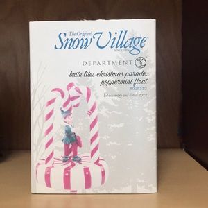 Snow village elf float department 56